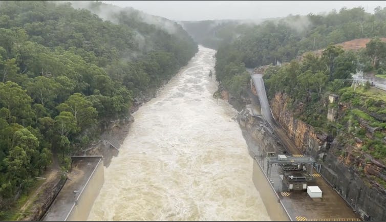 water spills from dam