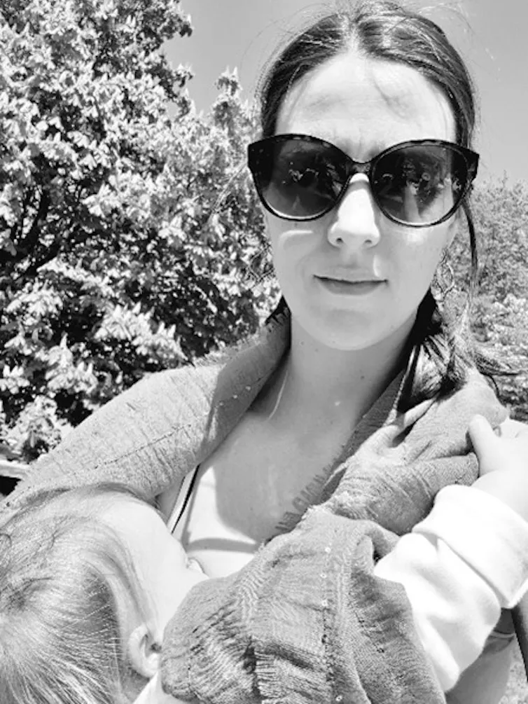 Woman breastfeeding outside