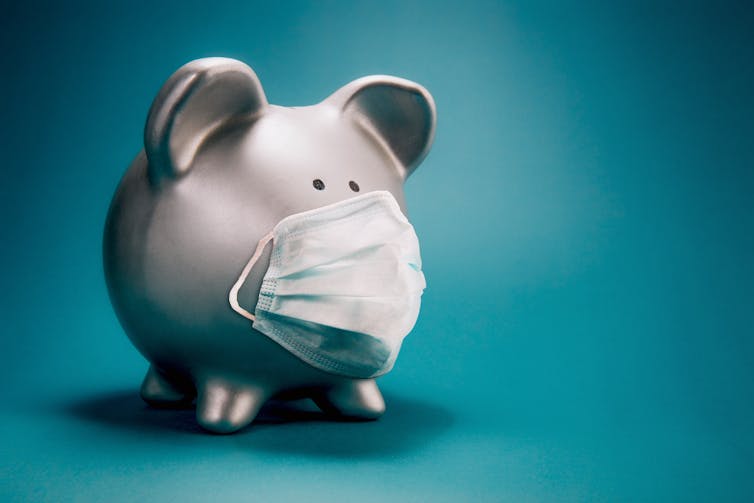 Piggy bank wearing a face mask.