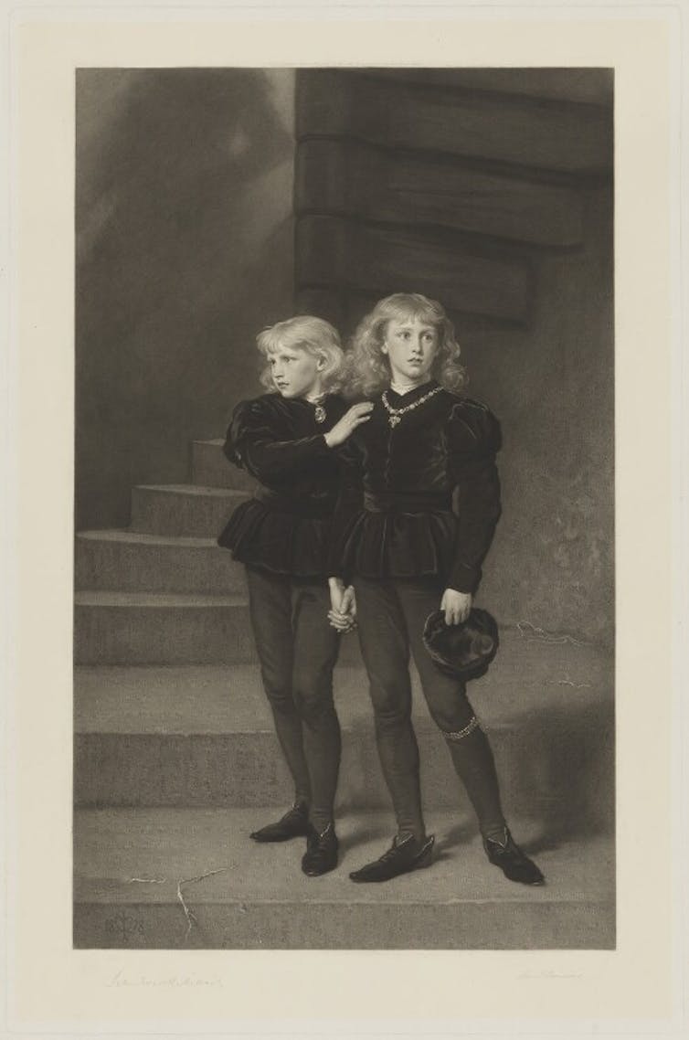 Portrait of two young boys on a staircase.