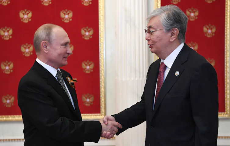 Russian president Vladimir Putin shakes hands with Kazakhstani president Kassym-Jomart Tokayev in Moscow in 2020.