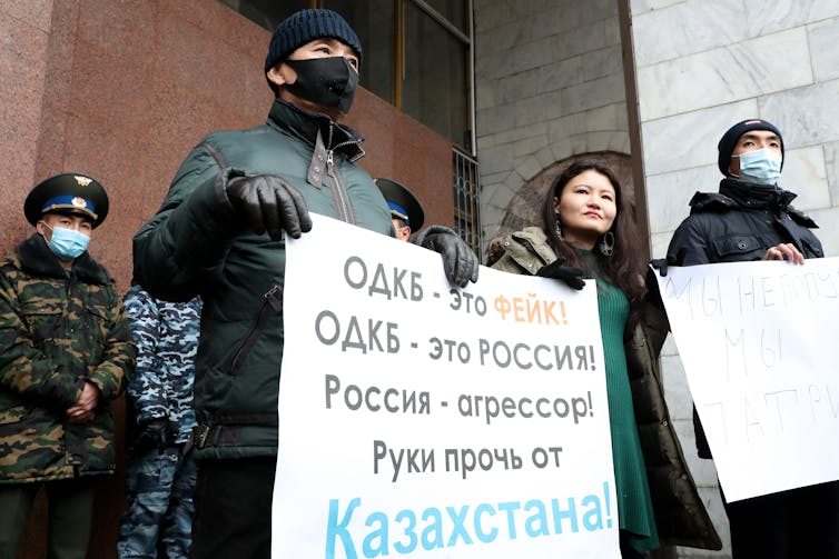 Kazakhstani protesters with a banner reading: 'CSTO is fake, the CSTO is Russia, Russia is the aggressor' during a protest in Almaty on January 7.