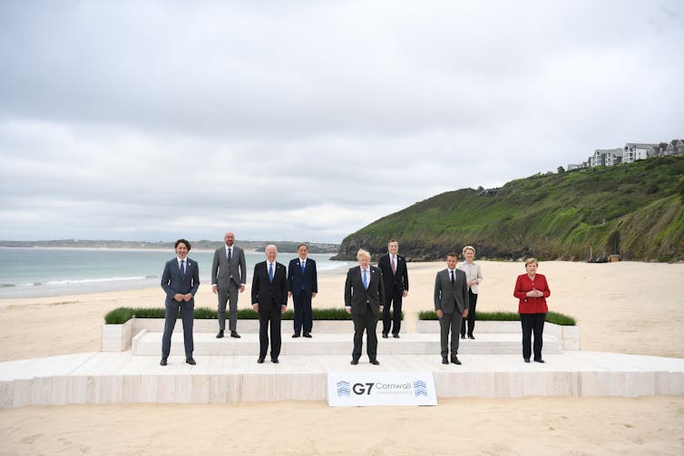 World leaders pose for a photo on the beach in Cornwall during the G7.