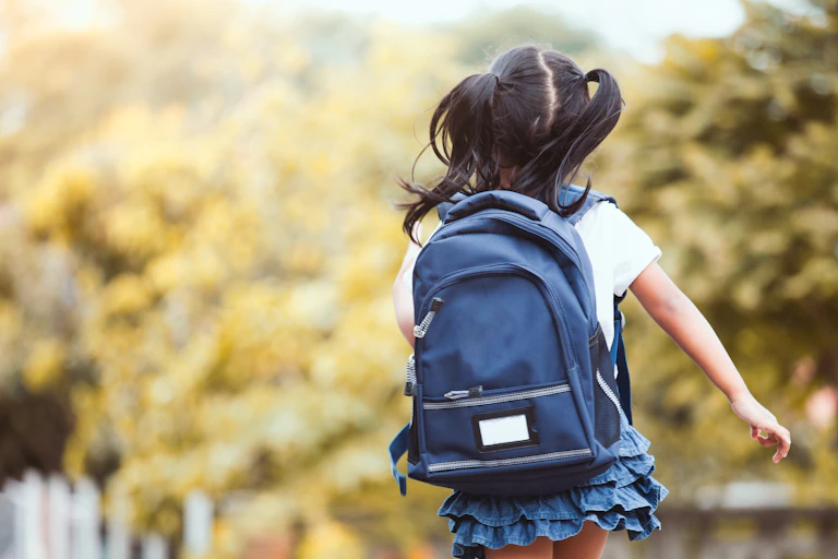 School student wearing backpack