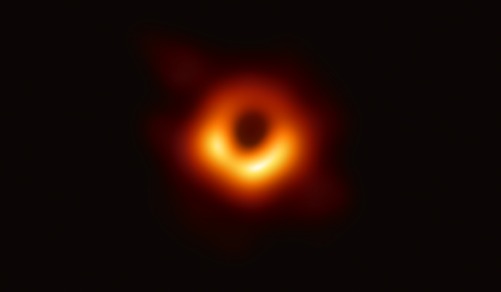 Fuzzy red ring of light around the first-ever photographed black hole