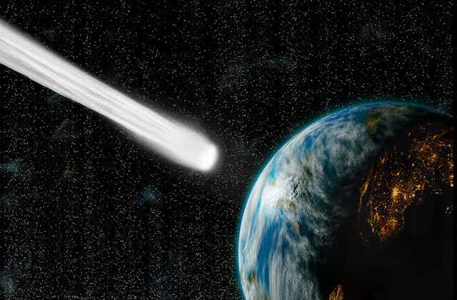 An illustration of a comet colliding with Earth.