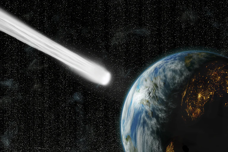 An illustration of a comet colliding with Earth.