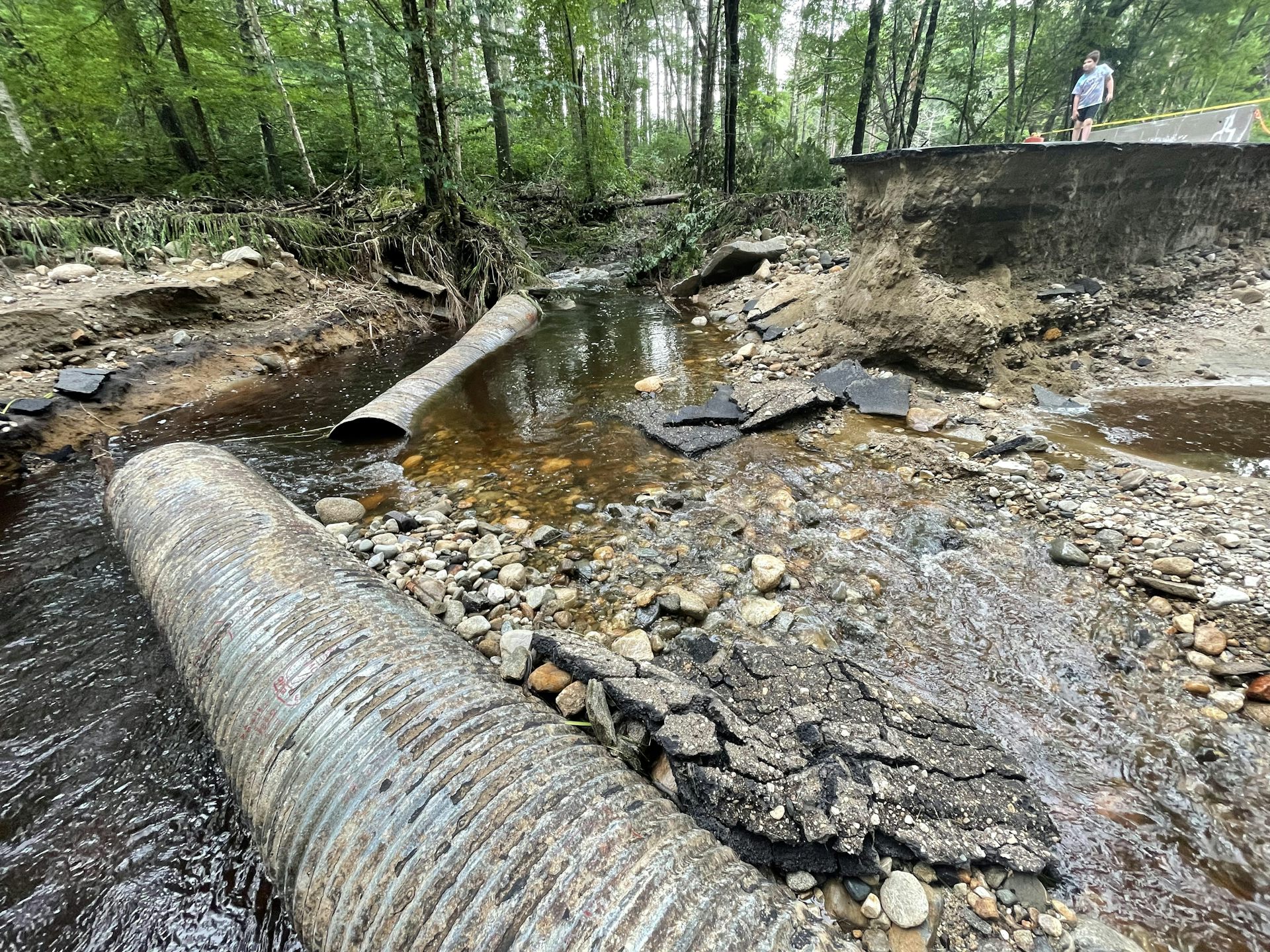Pipe in the middle of a flooded rural road