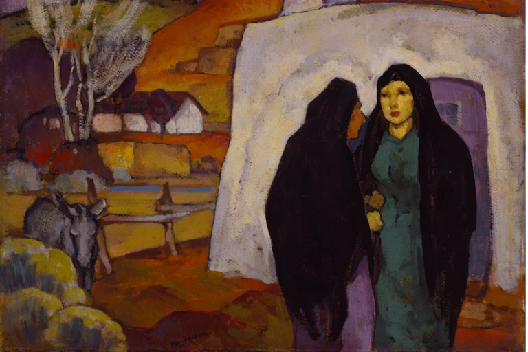 Two women wearing shawls chatting.