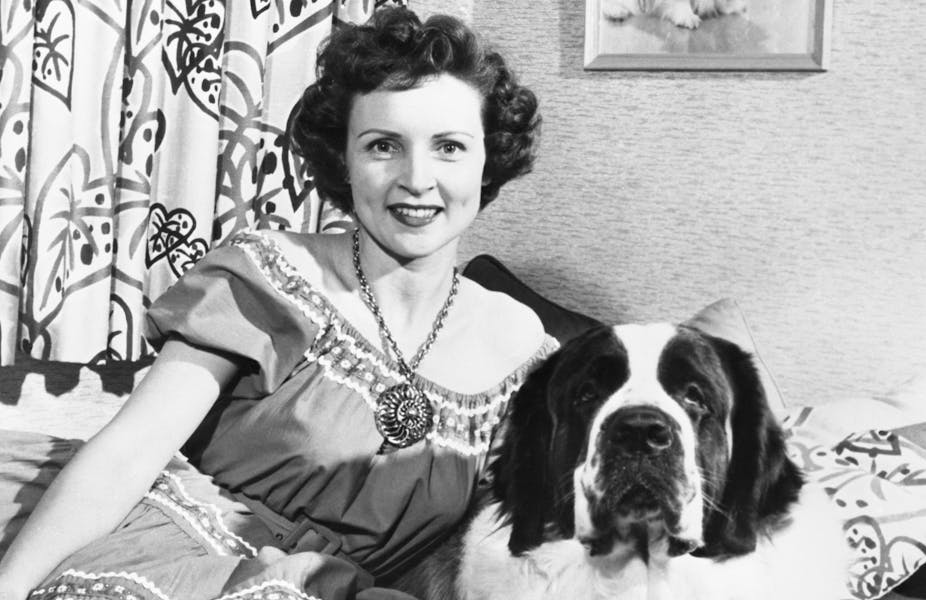 Betty White in her youth, with a pet dog.