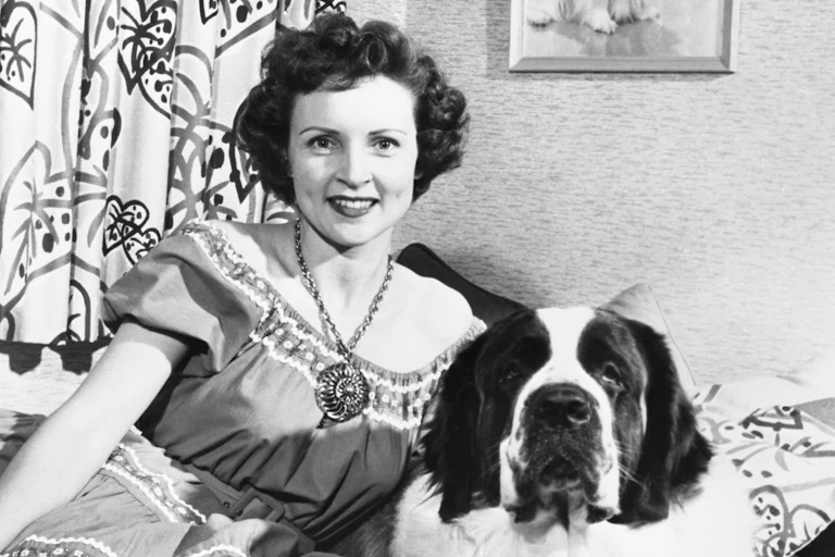 Betty White in her youth, with a pet dog.