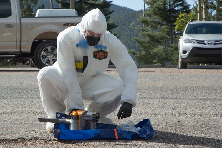 Officer in anti-terrorism protective suit