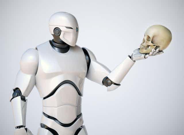 A robot holding a skull like in Hamlet.