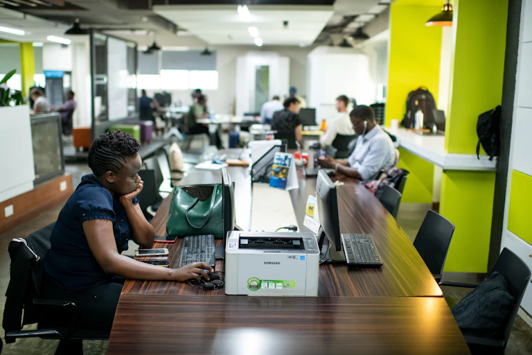IT specialists sit at computers in the iHub, an innovation centre for technology companies, Nairobi, Kenya.