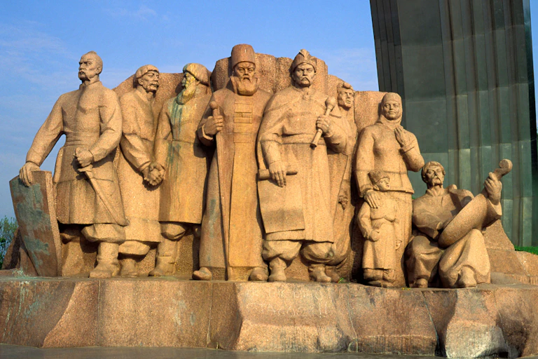 Sandstone statue from Kyiv, Ukraine showing important male historial figures from Russia and Ukraine.