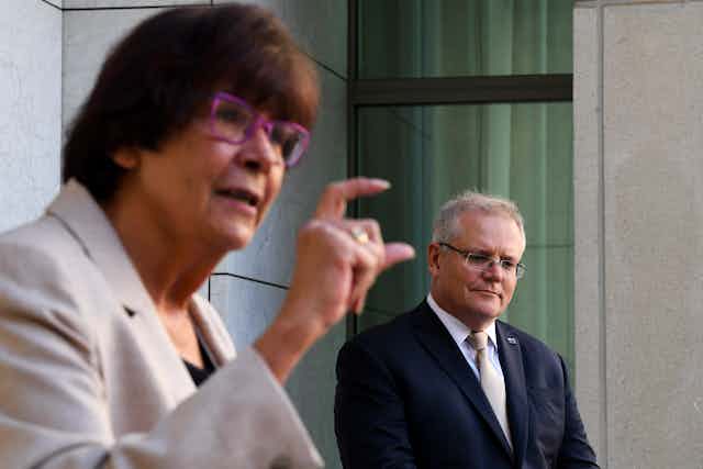 Australian Prime Minister Scott Morrison listens to senior advisor Pat Turner speak of the design of the Indigenous Voice to Parliament.