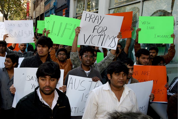 Indian students carry placards in a protest in Melbourne against racism