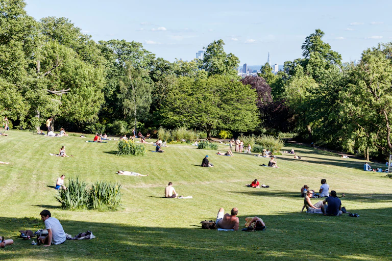 People spread out to socially distance in a London park during the lockdown of May 2020.