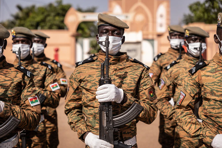 Soldiers holding rifles at a military parade