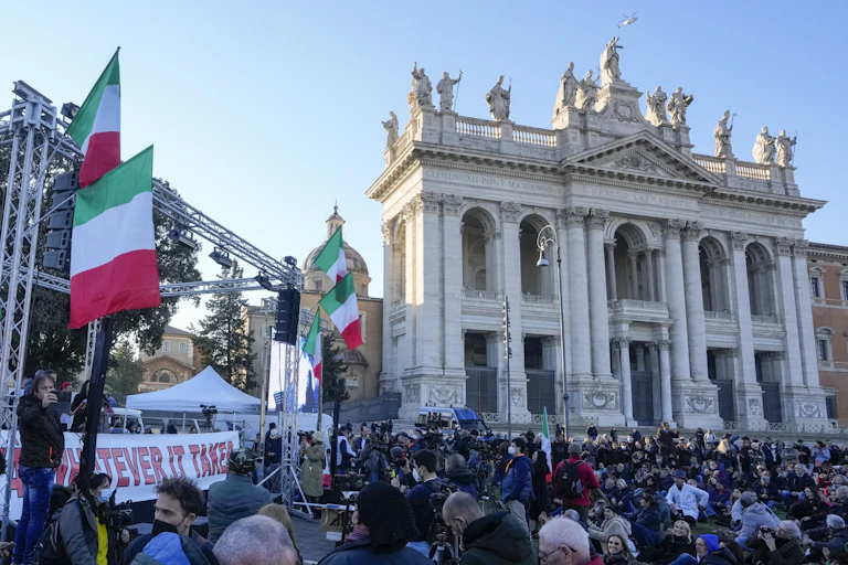 Italians in Rome protest against a new vaccine mandate.