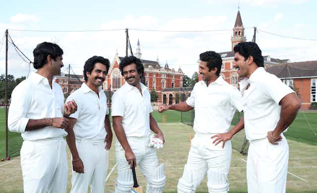 Five Indian men in cricket whites