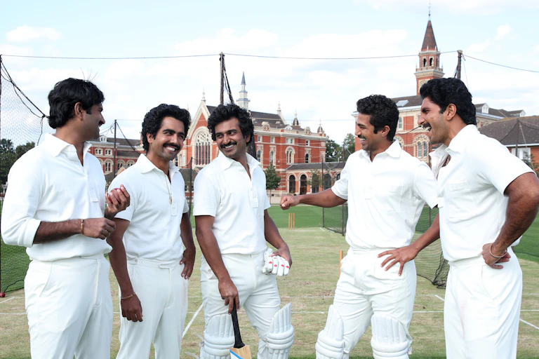 Five Indian men in cricket whites