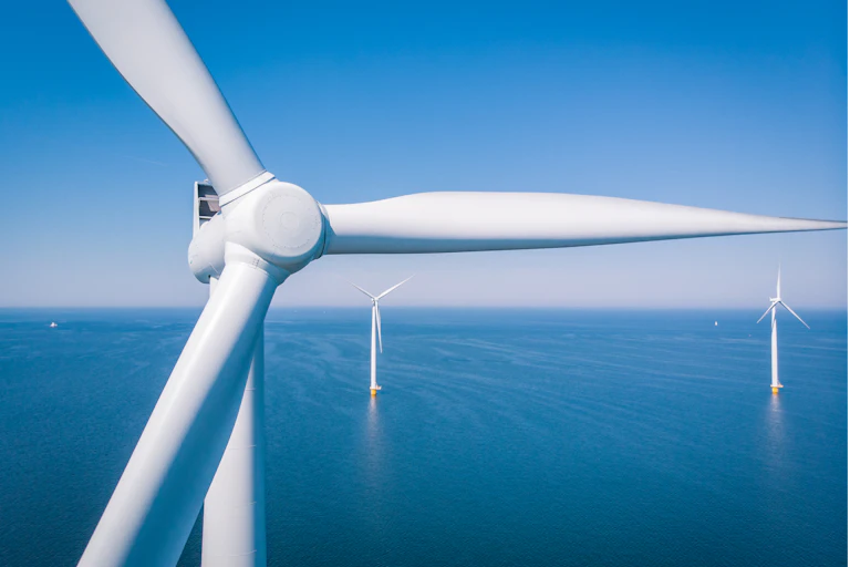 Three offshore wind turbines.