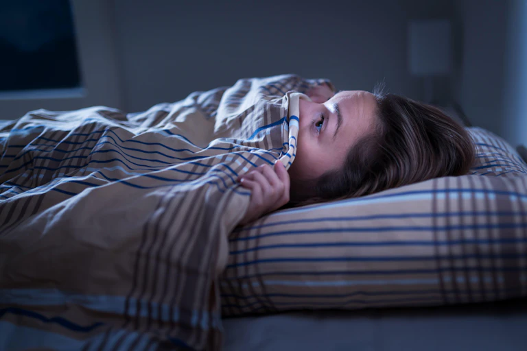 Scared person in bed
