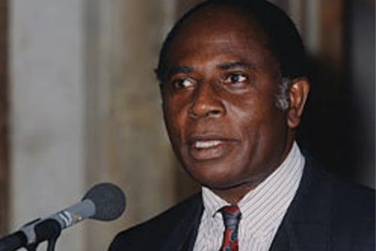 Image of a man speaking into a microphone