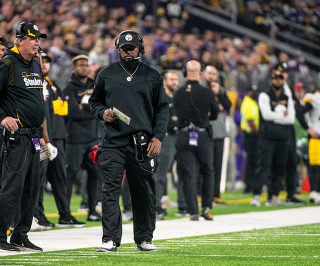 Head Coach Mike Tomlin walks the sidelines during recent game.