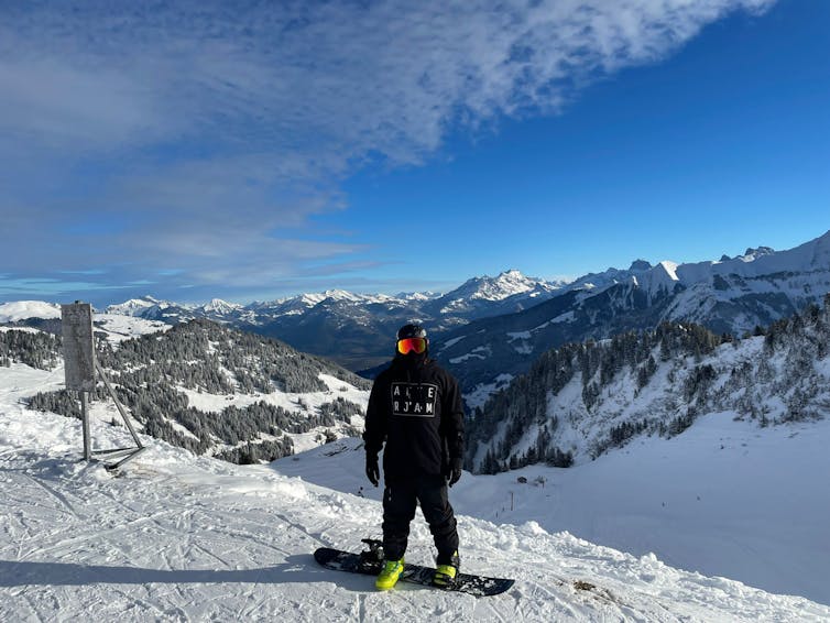 The author on a snowboard in the Alps.