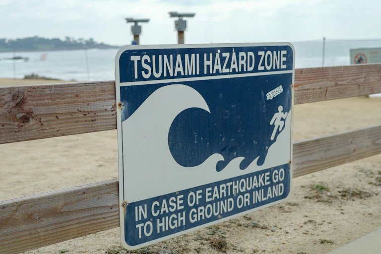 A sign warning about tsunami hazards.
