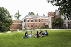 Students gather on a college yard.
