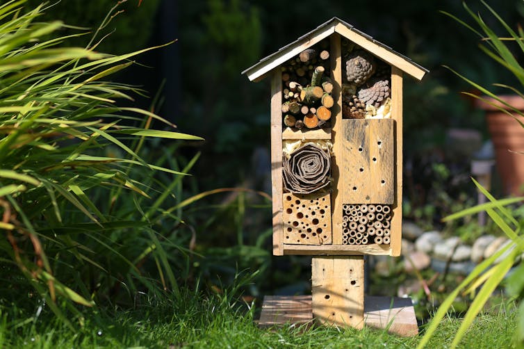 A bee house in a garden.