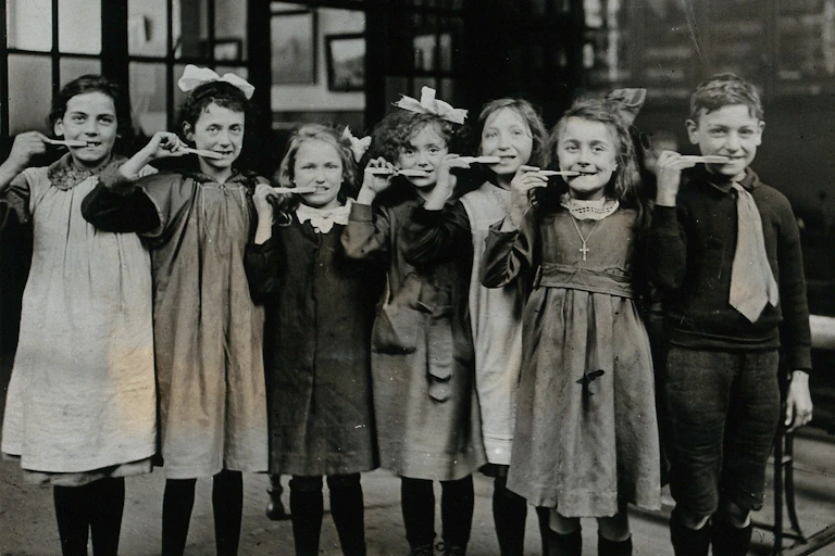 Pupils pose during a toothbrush drill at school in 1920.