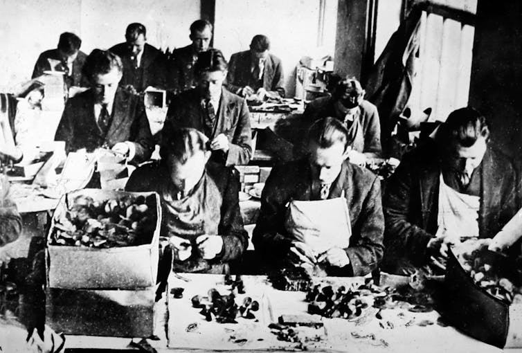 Disabled ex-servicemen make silk poppies for Earl Haig's appeal.
