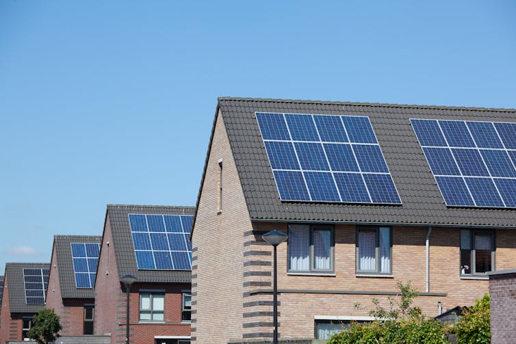 Houses with solar panels on the roof.