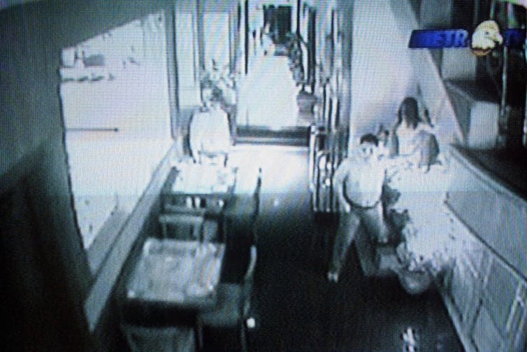 still of surveillance footage from a hotel