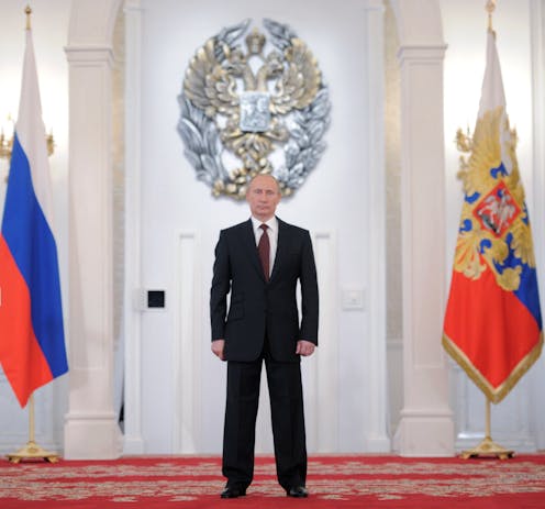 A year after Navalny's return, Putin remains atop a changed Russia
