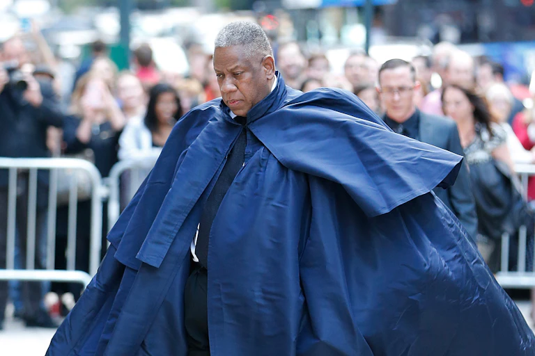 Andre Leon Talley in a large, blue cape