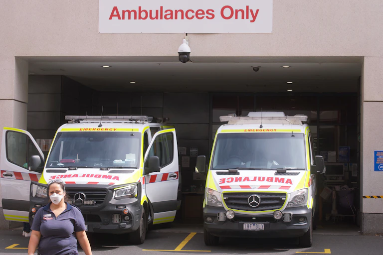Two ambulances in front of a hospital