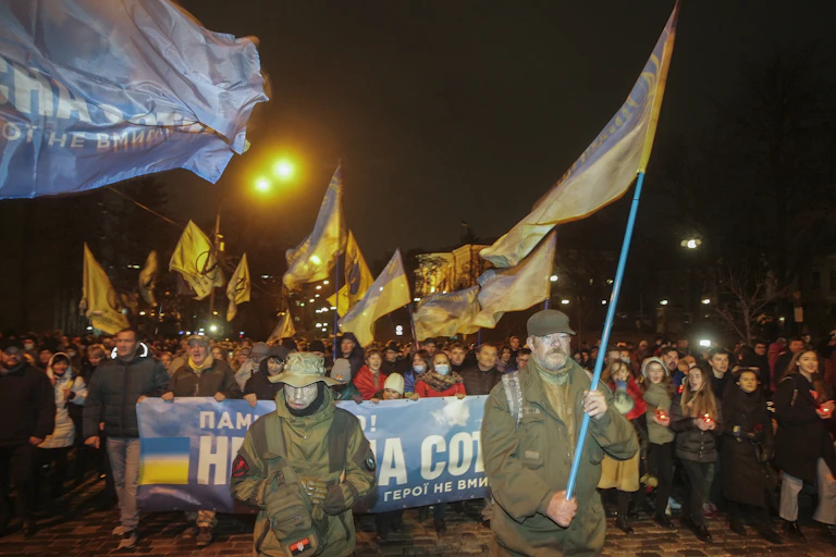 Ukranian naitonalists march through Kyiv with national flags