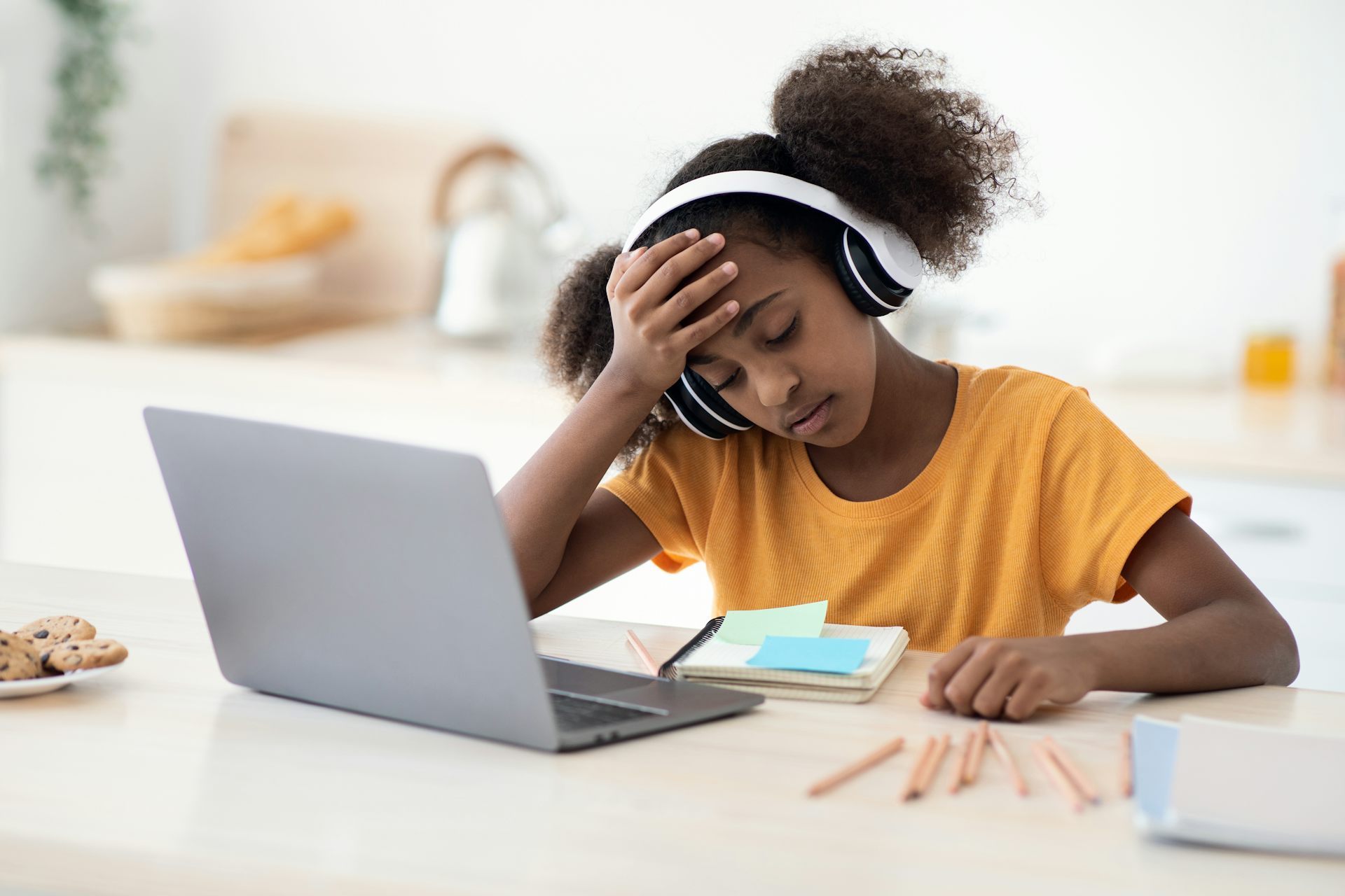 Girl looking worried at laptop