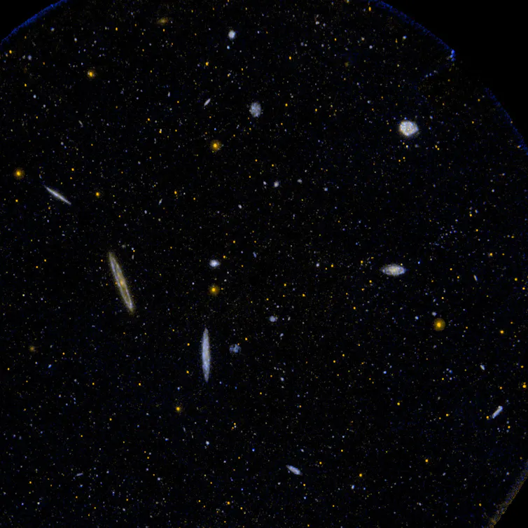 small light galaxies on black background