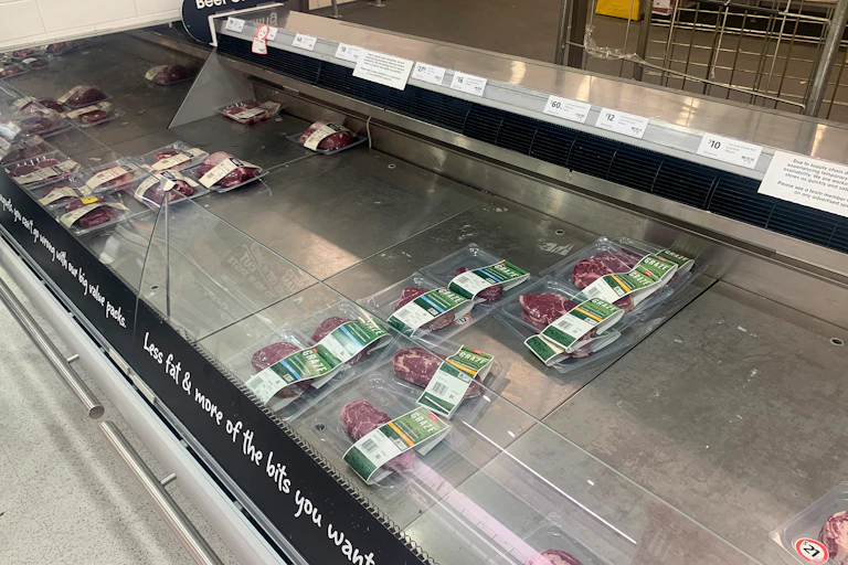 Empty shelves of meat products are seen at a supermarket in Sydney on January 12 2022.