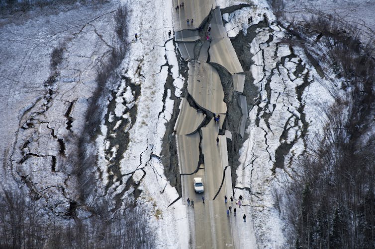 A road cracked and damaged by earthquakes