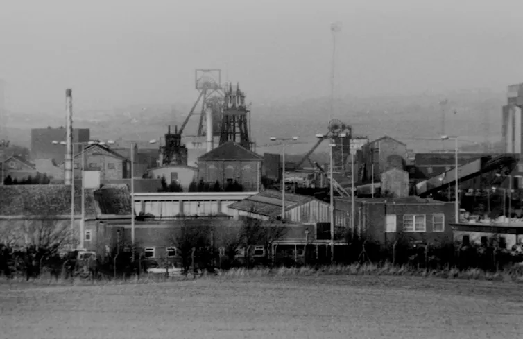 A black and white photo of a coal pit