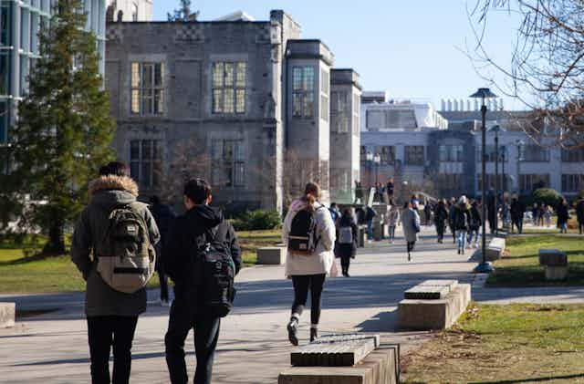 Students seen walking on a campus.