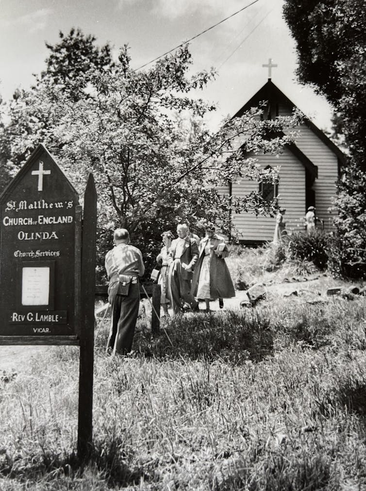 A crowd outside a country church.