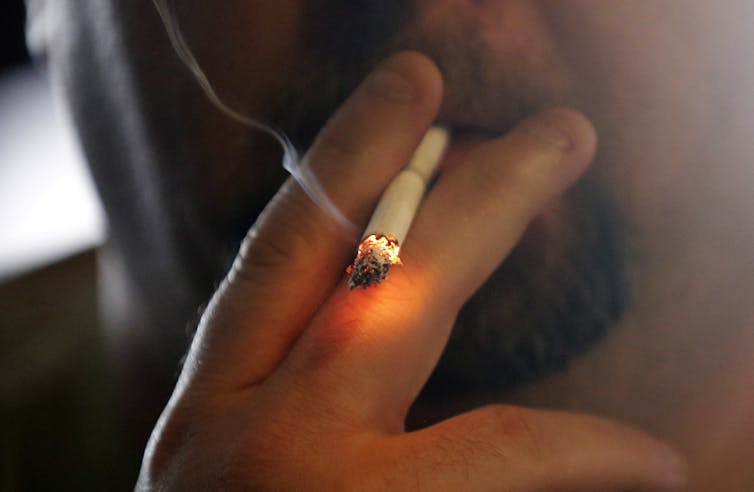 man smoking close up